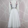 White tulle , cross front, midi length, hand embroidered dress, with U scoop back. One of a kind, made in France.