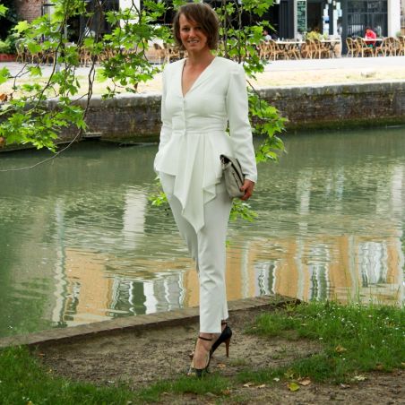 Woman ivory asymmetrical wedding peplum jacket