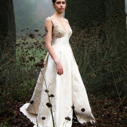Long sleeveless asymmetrical wedding dress with train
