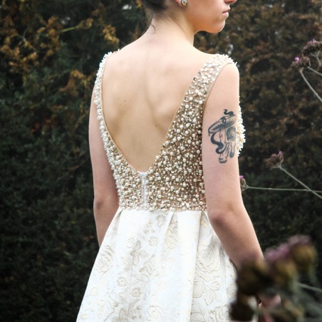 Zoom of luxury jacquard evening gown with U back and hand applied embellishments