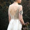 Zoom of luxury jacquard evening gown with U back and hand applied embellishments