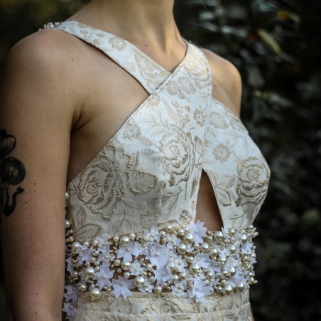 Close-up of the intricate hand-embellished details on the bodice.