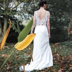 Sleeveless high slit wedding dress with long train and open back
