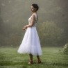 Artistic shot showing the dress in motion, highlighting softness and elegance.