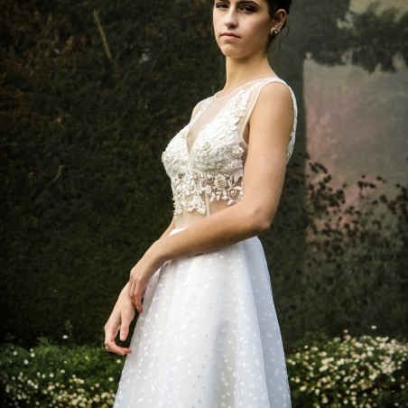 Side view highlighting the flowing full-circle skirt and modern hand embroidery