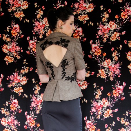 Evening blazer with classic notched collar, glamorous tweed texture, and delicate lace embellishments.