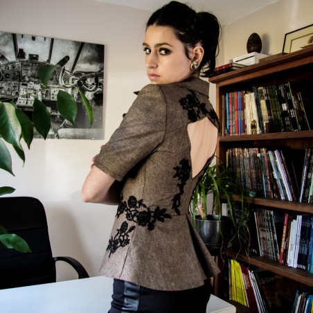 Short evening blazer in glamorous shiny tweed with subtle sparkle, featuring lace, beads, and pearl embellishments.