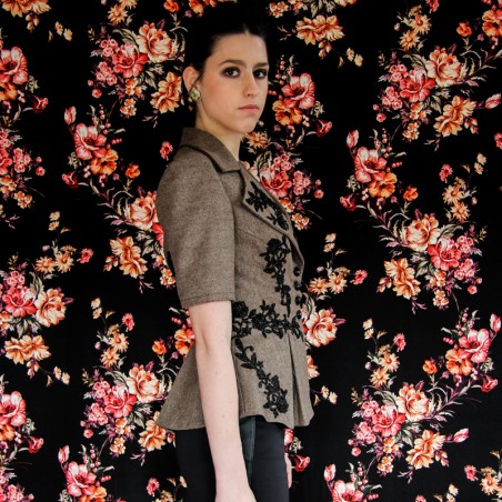 Short peplum jacket made in France, fully lined, with elegant black glass buttons and artisanal beadwork.