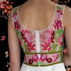 zoom on back view of floral hand embroidery on sleeveless midi dress
