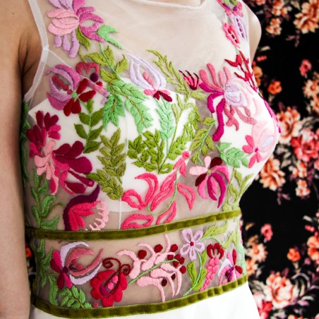 Zoom on hand embroidery of White floral sleeveless midi length bridal or cocktail dress