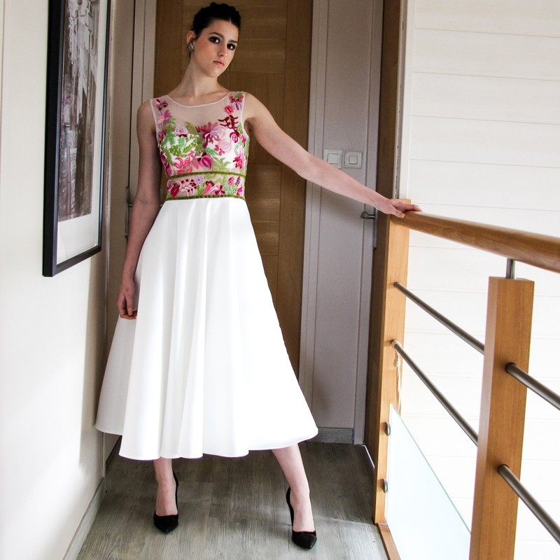 Full view of Elegant white satin dress with artisan embroidery