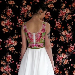 zoom on back view of floral hand embroidery on sleeveless midi dress