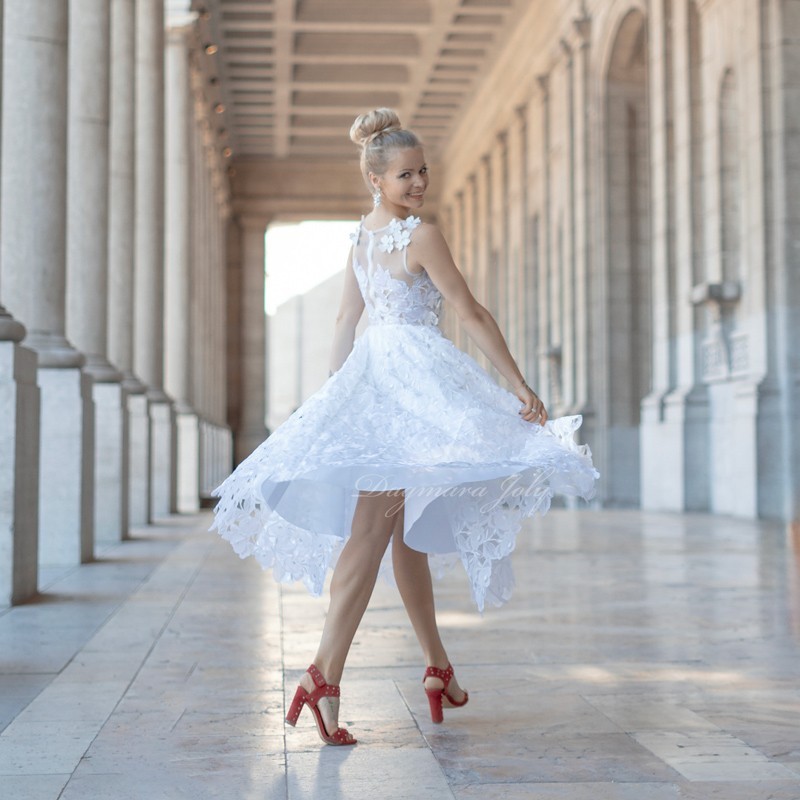 Bride twirling in French lace midi wedding dress – showcasing soft flow and elegant silhouette in motion.