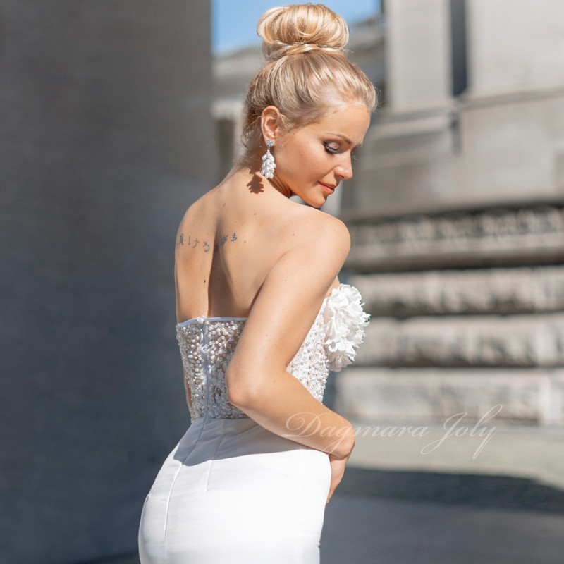 Back of French handmade strapless bridal dress with pencil cut silhouette and intricate detailing