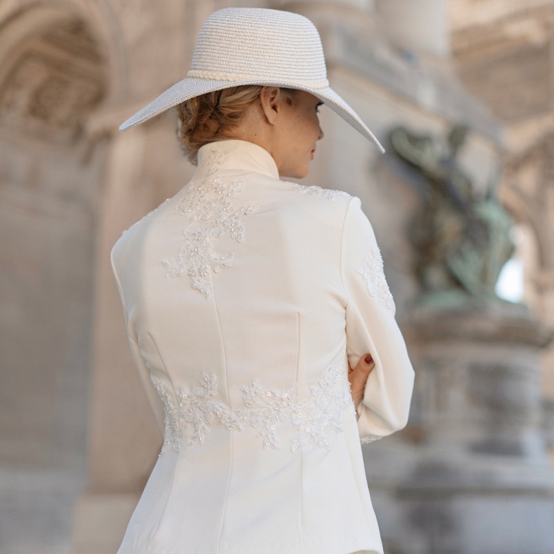 Back view of the suit, highlighting the detailed craftsmanship and finishing.