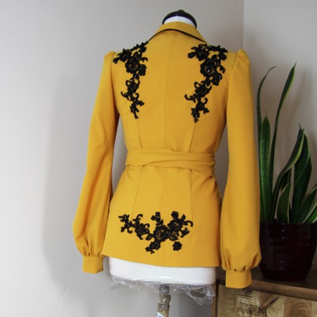 Back view of mustard shawl collar evening jacket for women
