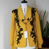 Mustard shawl collar jacket with black lace and bead embellishments with long belt – front view Mustard shawl collar jacket with black lace and bead embellishments with long belt – front view